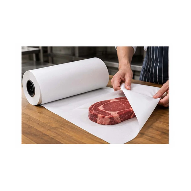 Person wrapping a fresh cut of beef with white butcher paper from a large roll