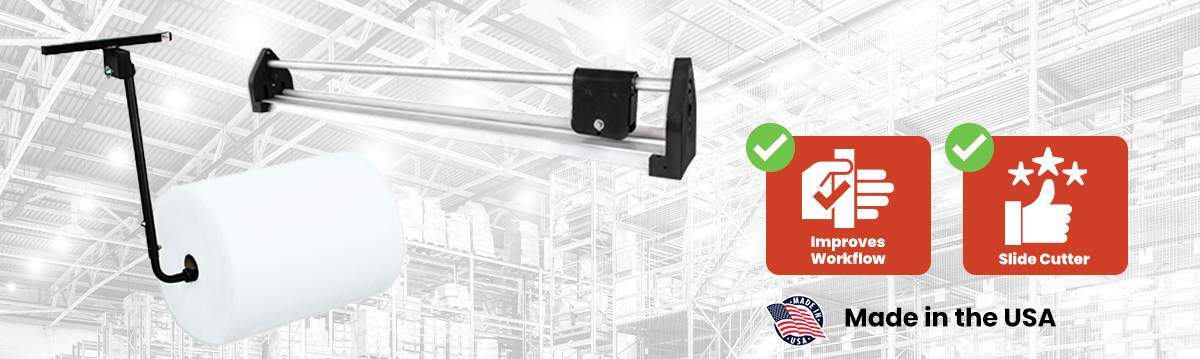 Wall-mounted bubble wrap and foam roll dispenser with slide cutter for efficient packaging workflow, made in the USA.