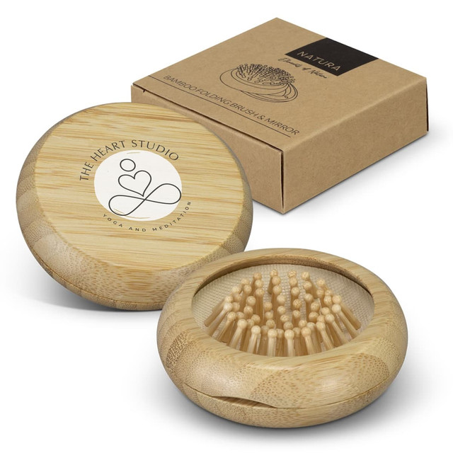 A bamboo brush and mirror set in a round case, accompanied by a brown outer box with a logo.