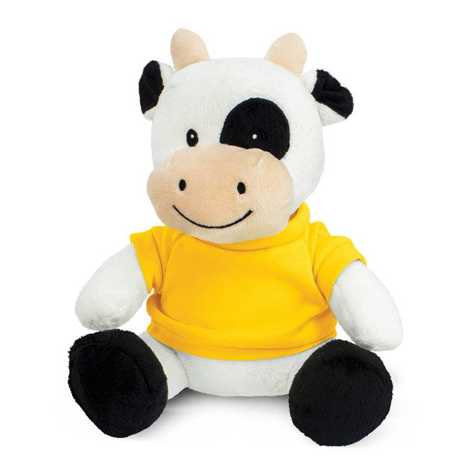 A cow plush toy with black and white fur, wearing a yellow shirt, sitting upright with a friendly smile.