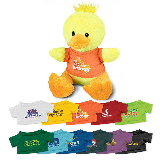 A yellow plush duck wearing an orange T-shirt, surrounded by various small T-shirts in different colours and logos.