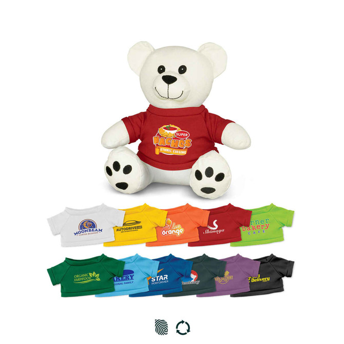 A plush white bear wearing a red shirt, surrounded by various coloured shirts in different shades. It has a logo on the shirt.