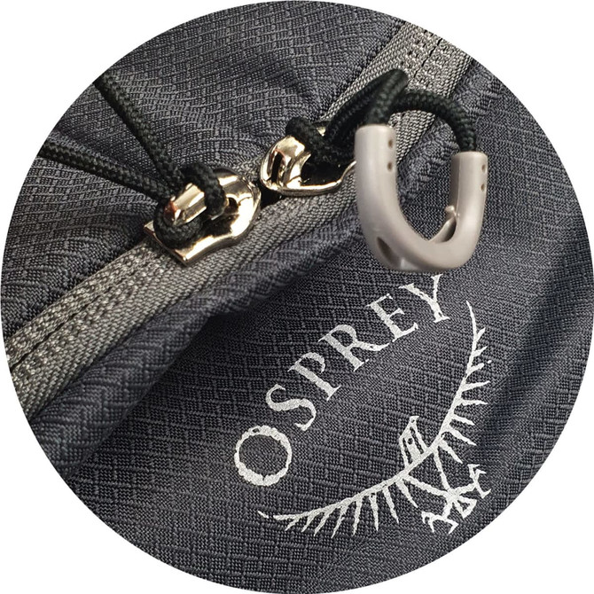 A close-up of a grey Osprey Daylite Duffle Bag featuring zippers and a branded logo.