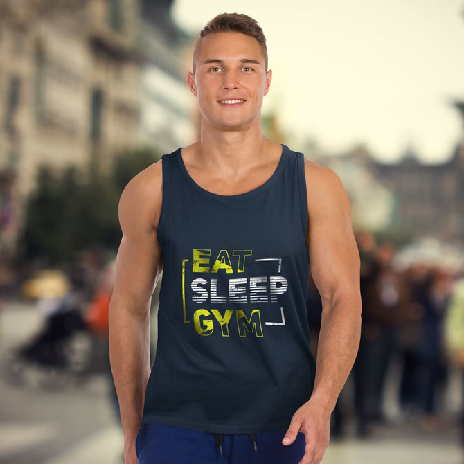 A dark navy men's tank top featuring a graphic design and a logo. The background shows an outdoor urban setting.