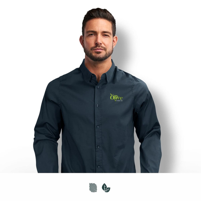 A navy blue button-up shirt with a logo, featuring a collar and long sleeves, worn by a man.