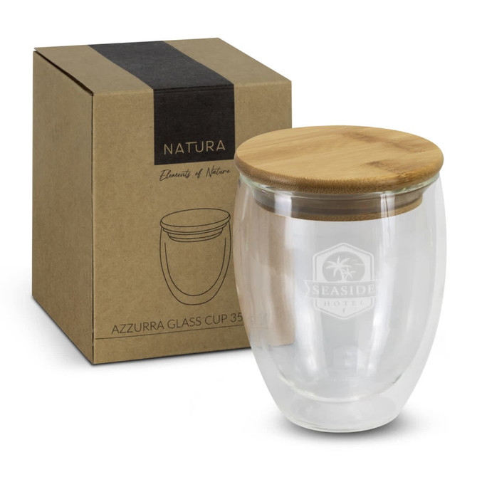 A glass cup with a bamboo lid, featuring a clear design and a box for packaging, showcasing a natural aesthetic.
