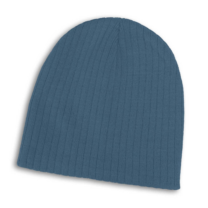 A blue cable knit beanie featuring ribbed texture and a simple design. It has a logo on the side.