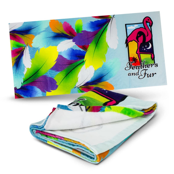 A colourful beach towel featuring vibrant feathers and a flamingo design. It has a logo on one side.