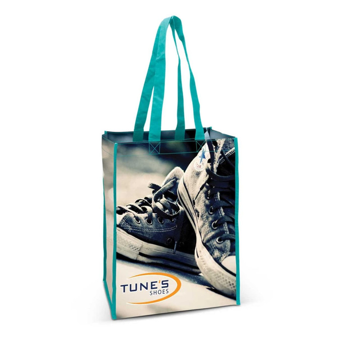 A tote bag with a blue and grey design featuring sneakers, complemented by turquoise handles and a logo.