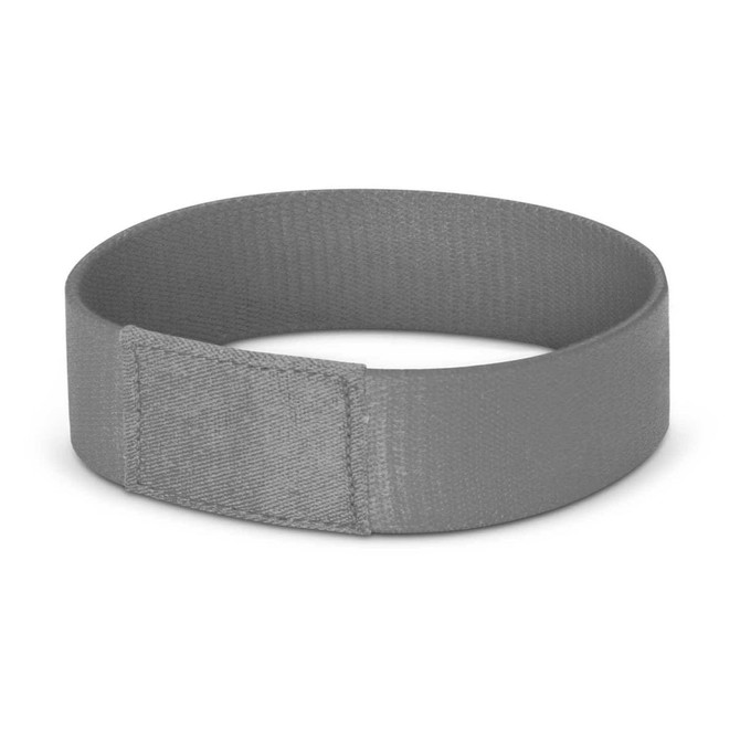 A grey wristband with a smooth finish and a fold-over design. It features a branding logo.