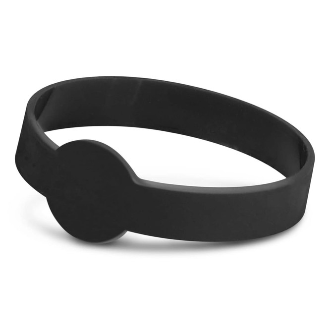 A black silicone wristband with a debossed circular detail and a smooth surface.