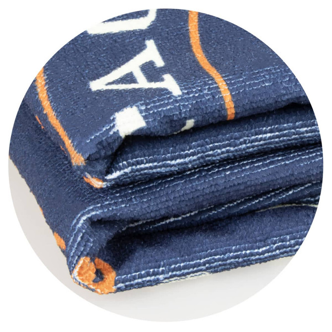 A navy hooded towel folded neatly, featuring an orange design and a logo.