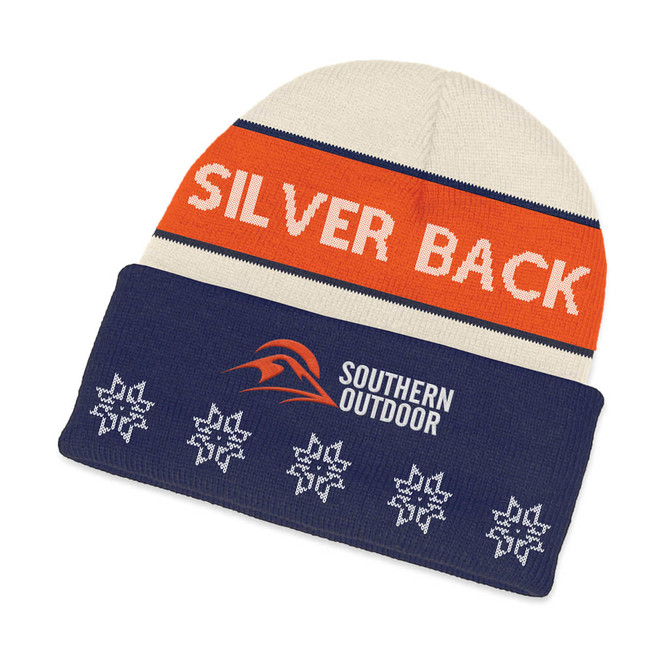 A custom knitted beanie featuring a cream top and a navy brim with a logo and decorative snowflakes.