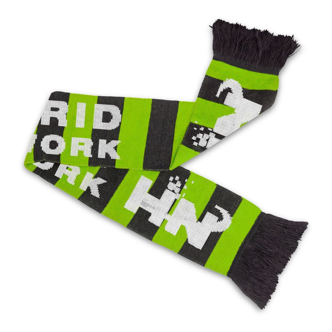 A green and black knitted scarf with a fringe, featuring a patterned design and a logo.