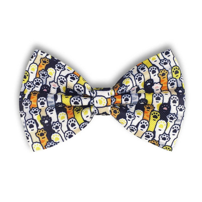 A bow tie featuring a playful pattern of colourful ghosts on a dark background. It has a branding logo.