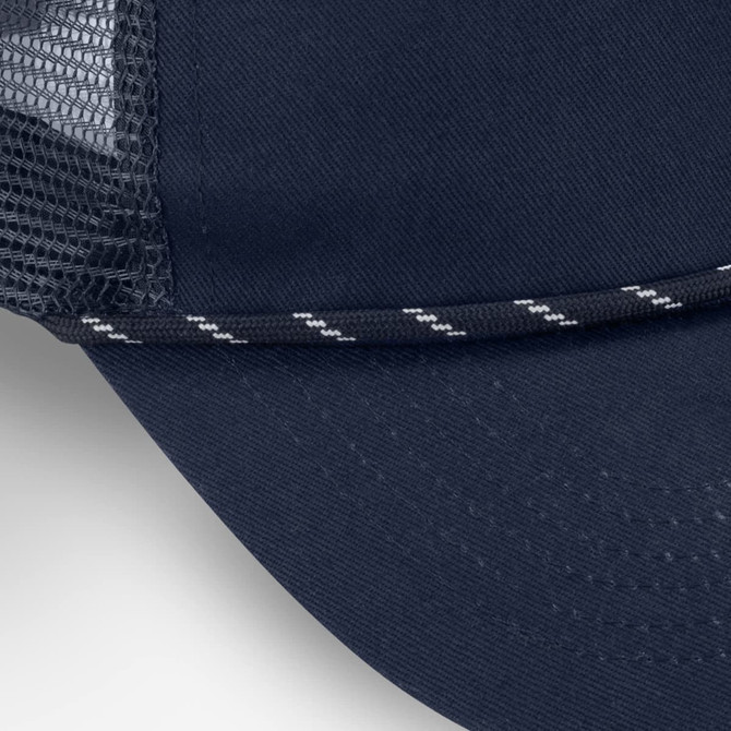 A navy trucker cap featuring a mesh back and a decorative striped band along the brim.