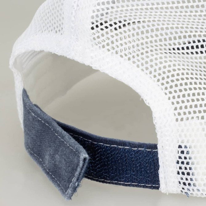 A faded navy trucker cap with a white mesh back and a dark fabric strap at the rear.