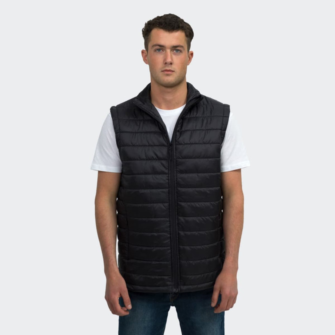 A unisex black puffer vest with a zip front, featuring a hood and side pockets, modelled by a male model.