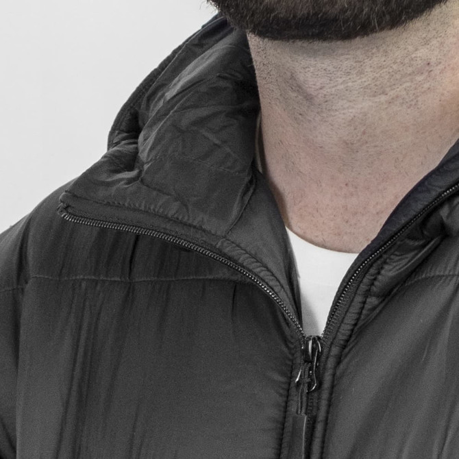 A black puffer jacket with a high collar and zipper closure, featuring a small logo on the chest.
