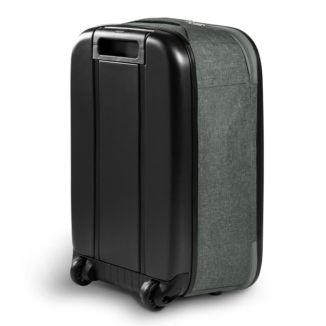 A medium wheeled suitcase in dark green fabric and black hard shell, featuring a logo.