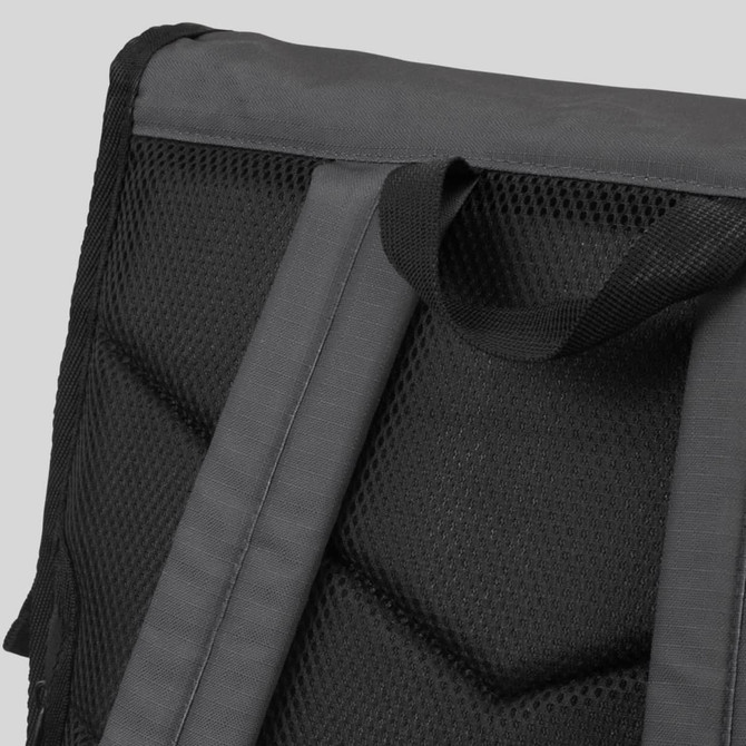 A black Fjord Backpack featuring a textured mesh back panel and padded shoulder straps.