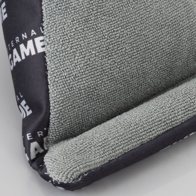 A green and black bean bag phone holder with a textured surface and a branding logo.