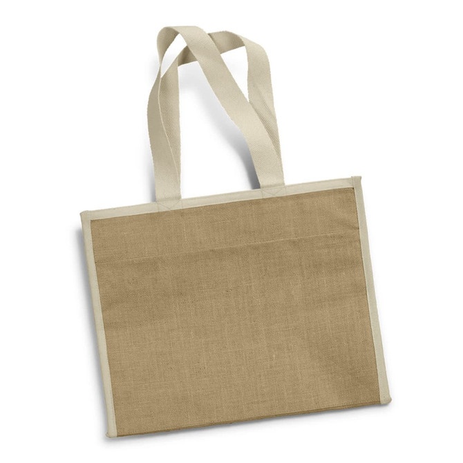 A jute cooler bag in a natural tan colour with contrasting cream straps and an uncomplicated design.
