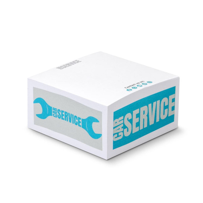 A white sticky cube with turquoise graphics featuring a wrench and text related to car service.