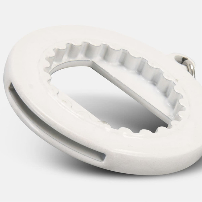 A drink bottle opener key ring in white featuring a circular design with a serrated edge and a metal attachment.