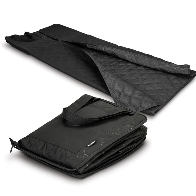 A black picnic blanket laid out flat, featuring a quilted texture, with a folded version showcasing a carrying handle.