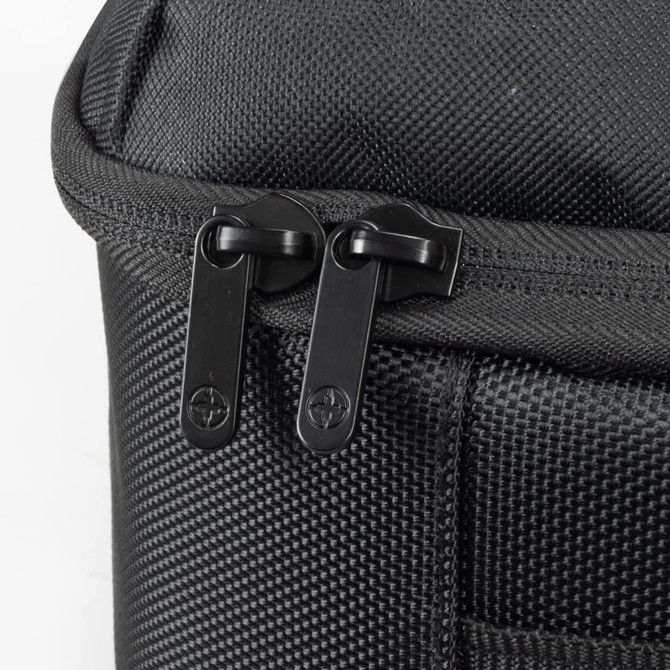 A black travel backpack featuring dual zippers and a textured fabric surface. It has a logo on the side.