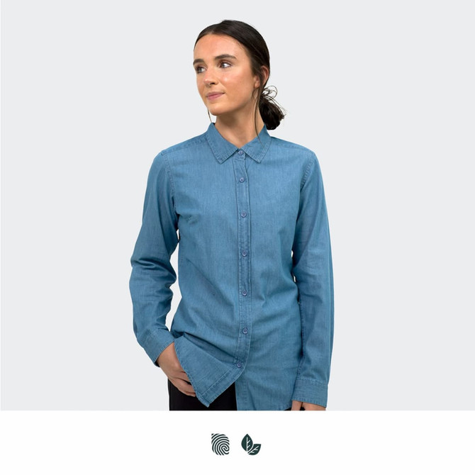 A women's button-up denim shirt in light blue, featuring a classic collar and long sleeves, with a subtle logo.