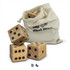 A set of three wooden yard dice with dots, presented alongside a cream drawstring bag.