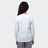 A white long sleeve crew shirt featuring a logo, shown from the back on a model.