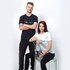 A black men's t-shirt and a white women's t-shirt with a logo are displayed on models against a plain background.