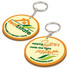 A PVC key ring with a round design, featuring yellow and orange colours and having logos on both sides.