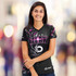 A women's sports V-neck T-shirt in black with pink and grey accents, featuring a logo on the sleeve.
