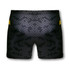 Custom women's volleyball shorts in black with a textured pattern and yellow accents. Features a logo.