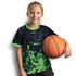 A girl wearing a black and green sports t-shirt holds a basketball, featuring a logo on the shirt.