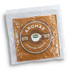 A square, brown cushion packaged in a clear plastic wrap, featuring a logo and design elements.