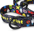 A dog leash featuring a colourful pattern with various playful designs and a black buckle. It has a logo on the strap.