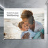 A large media wall featuring a parent and child by the beach, with a light background and a logo.