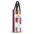 A full-colour paper bag in shades of pink, green, and yellow, with a black ribbon handle and a logo.