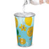 A drink cup featuring a blue design with yellow fruits and flowers, with a silver rim. It has a logo.