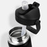 A drink bottle in black with a flip straw and stainless steel interior, featuring a lid with a logo.