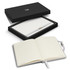 A notebook gift set featuring a white notebook with lined pages, presented in a black box with a logo.