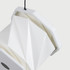 A white, foldable lantern with a geometric design, featuring a hanging string and a logo on the base.