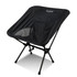 A lightweight folding chair in black with a mesh side panel and a sturdy metal frame. It features a branding logo.