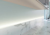 Flexible LED strip lighting installed along the worktop upstand in a kitchen, providing a soft and indirect illumination. The sleek design complements the modern kitchen aesthetic, enhancing both functionality and style