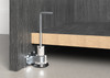 Heavy-duty adjustable furniture leg fitted beneath a cabinet base panel, allowing precise height adjustment and stable support for heavy furniture installations.